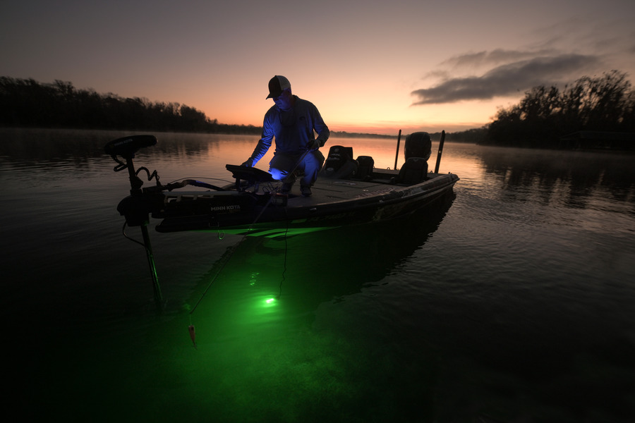Fisherman on boat fishing with NEBO submersible fishing light